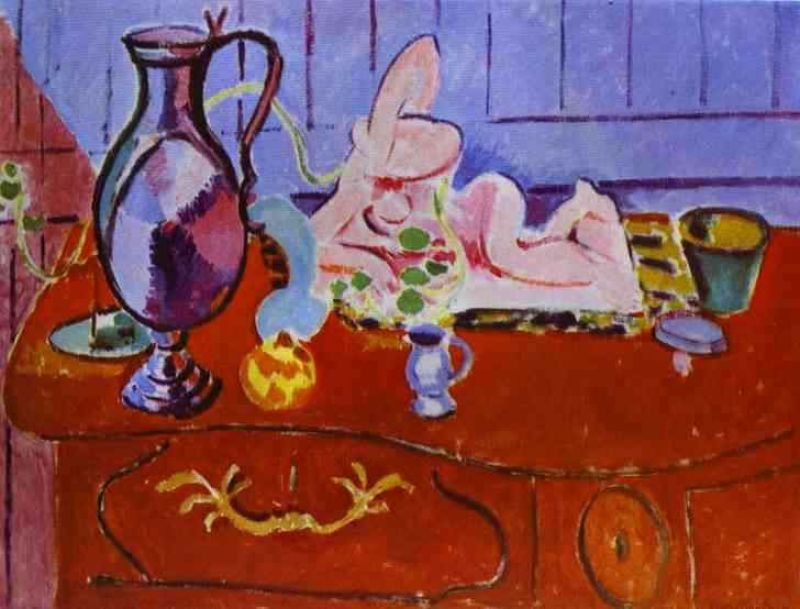 pink statuette and pitcher on a red chest of drawers.jpg